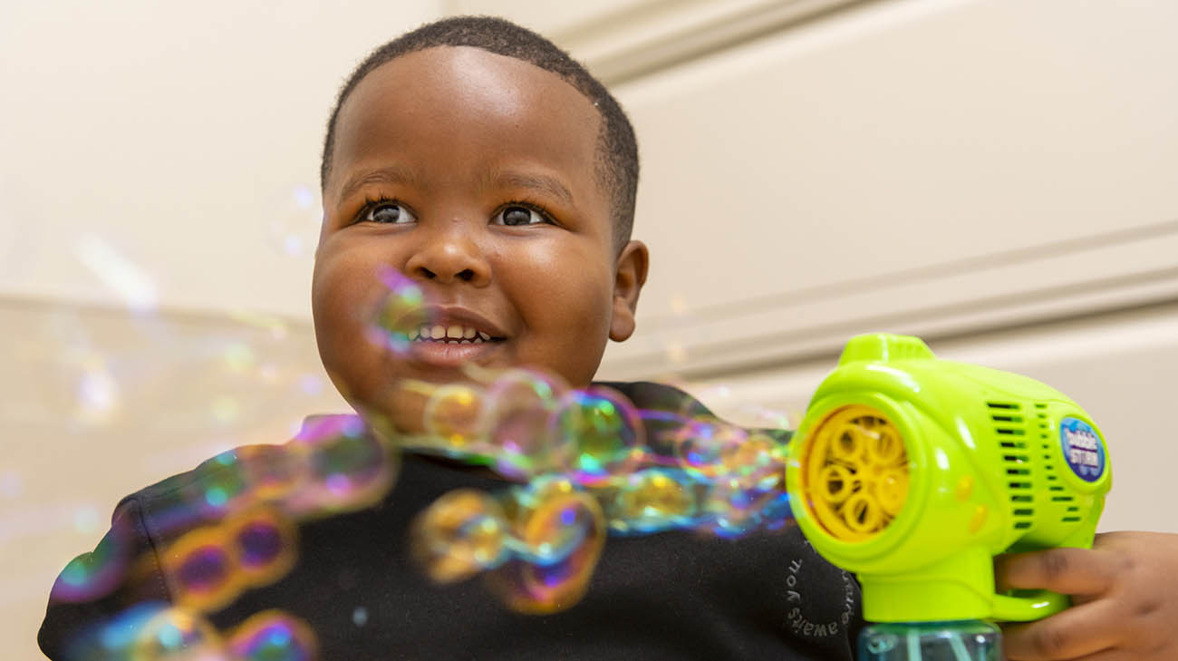 Carter playing with bubbles at Cleveland Clinic Children's Center for Autism in Rocky River, Ohio.